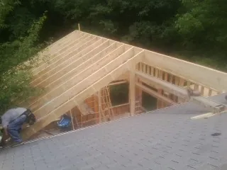 Framing a new roof addition that ties into an existing shingle roof in Billings